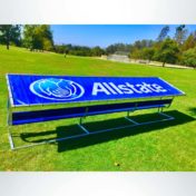 Covered athletic team bench with custom logo cover and custom colored royal blue bench.