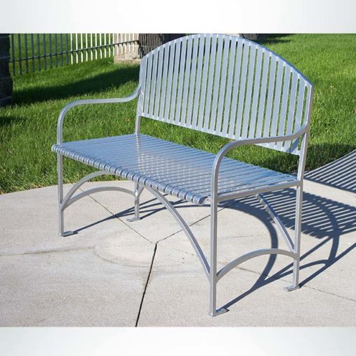 Model #PREB48. Metal outdoor bench in silver for city streets and parks.