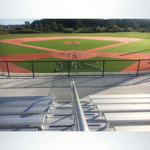 Custom engineered tieback baseball netting at a high school baseball stadium. View from bleachers.