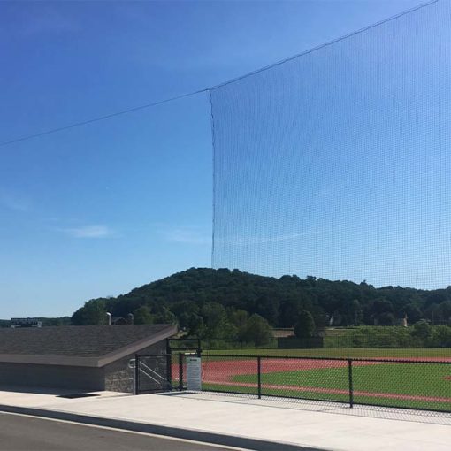 Tie-back nets at high school baseball field.