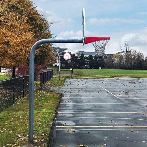 Model #KG4908. 8' high gooseneck basketball pole at school playground.