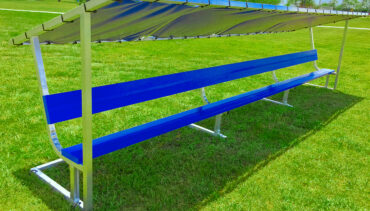 Covered athletic team bench. Royal blue bench seat and bench cover.