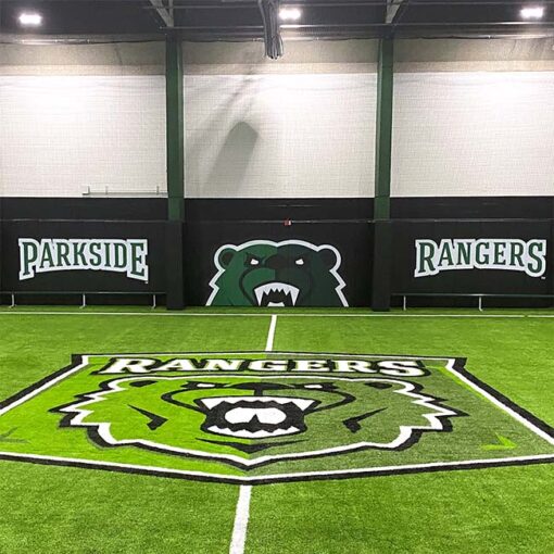 Indoor soccer training field with custom wall padding with school logo and name. UW-Parkside Athletics.