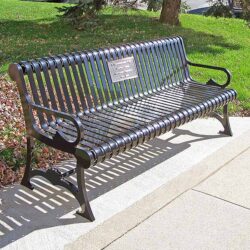 Memorial park bench with a commemorative plaque